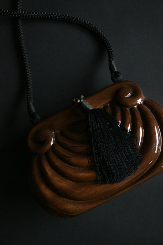 wooden sculptural tassel purse