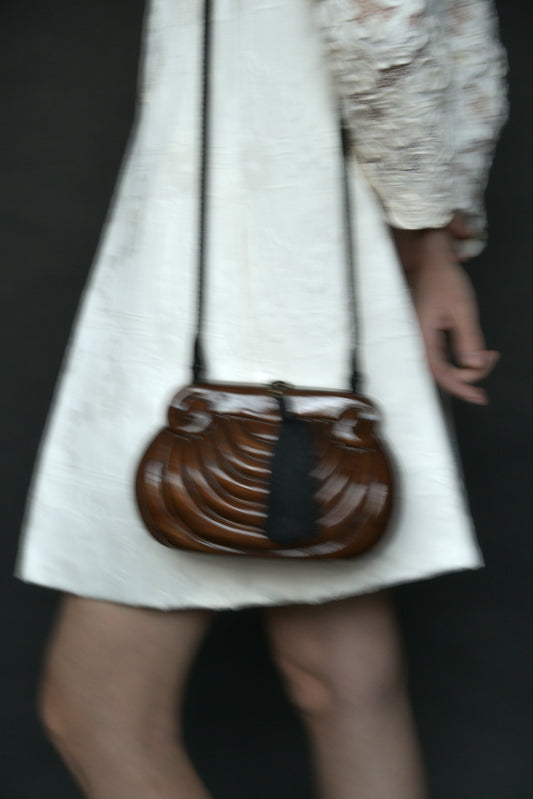 wooden sculptural tassel purse