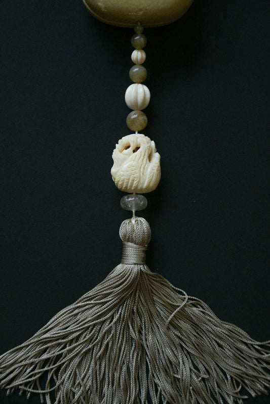 carved bird tassel beaded minaudière purse