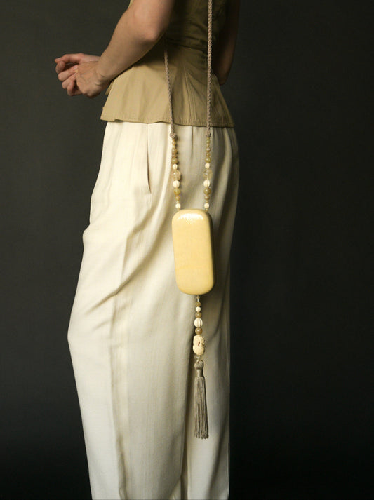 carved bird tassel beaded minaudière purse