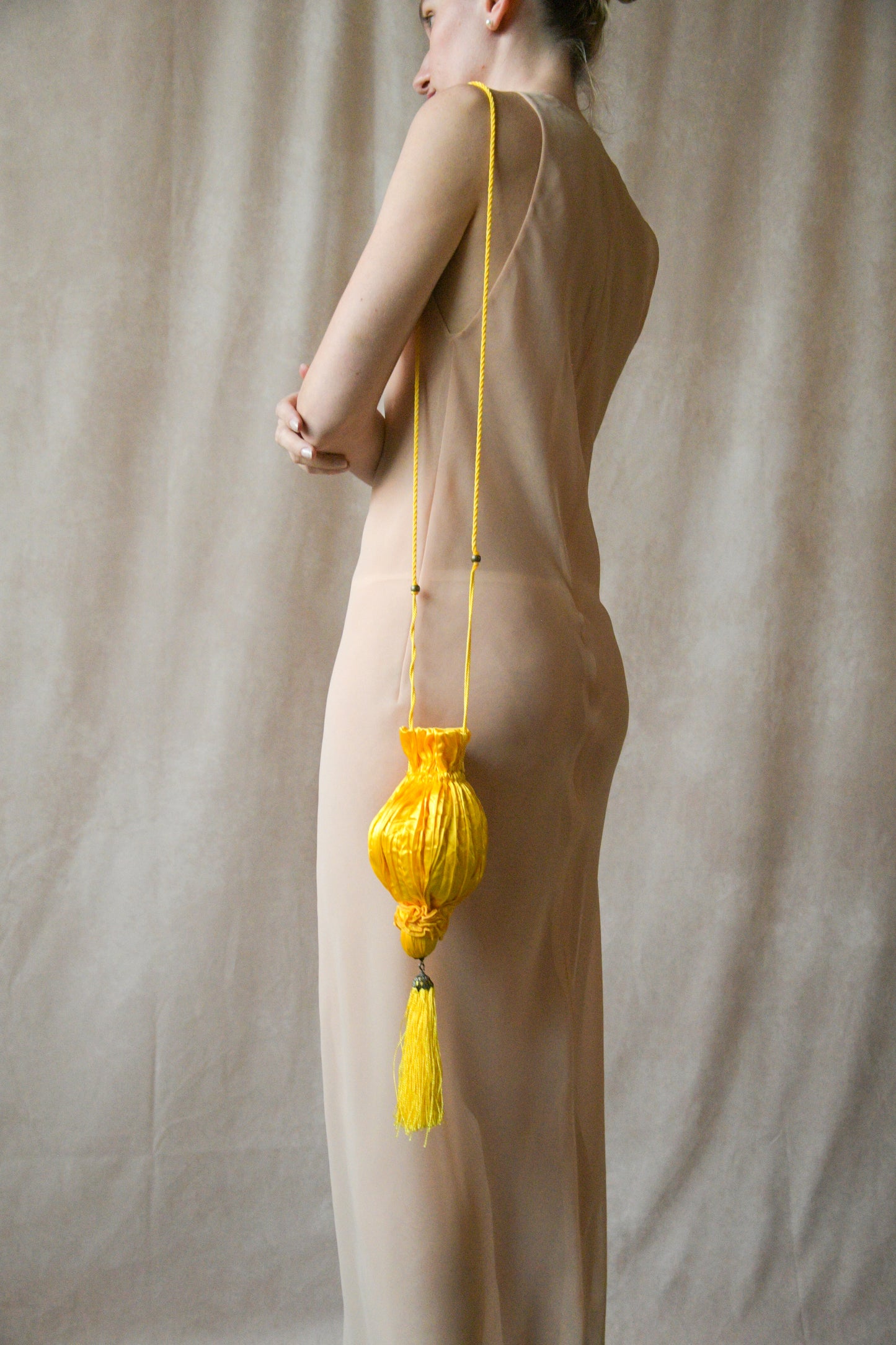 yellow satin crinkled pouch purse with tassel