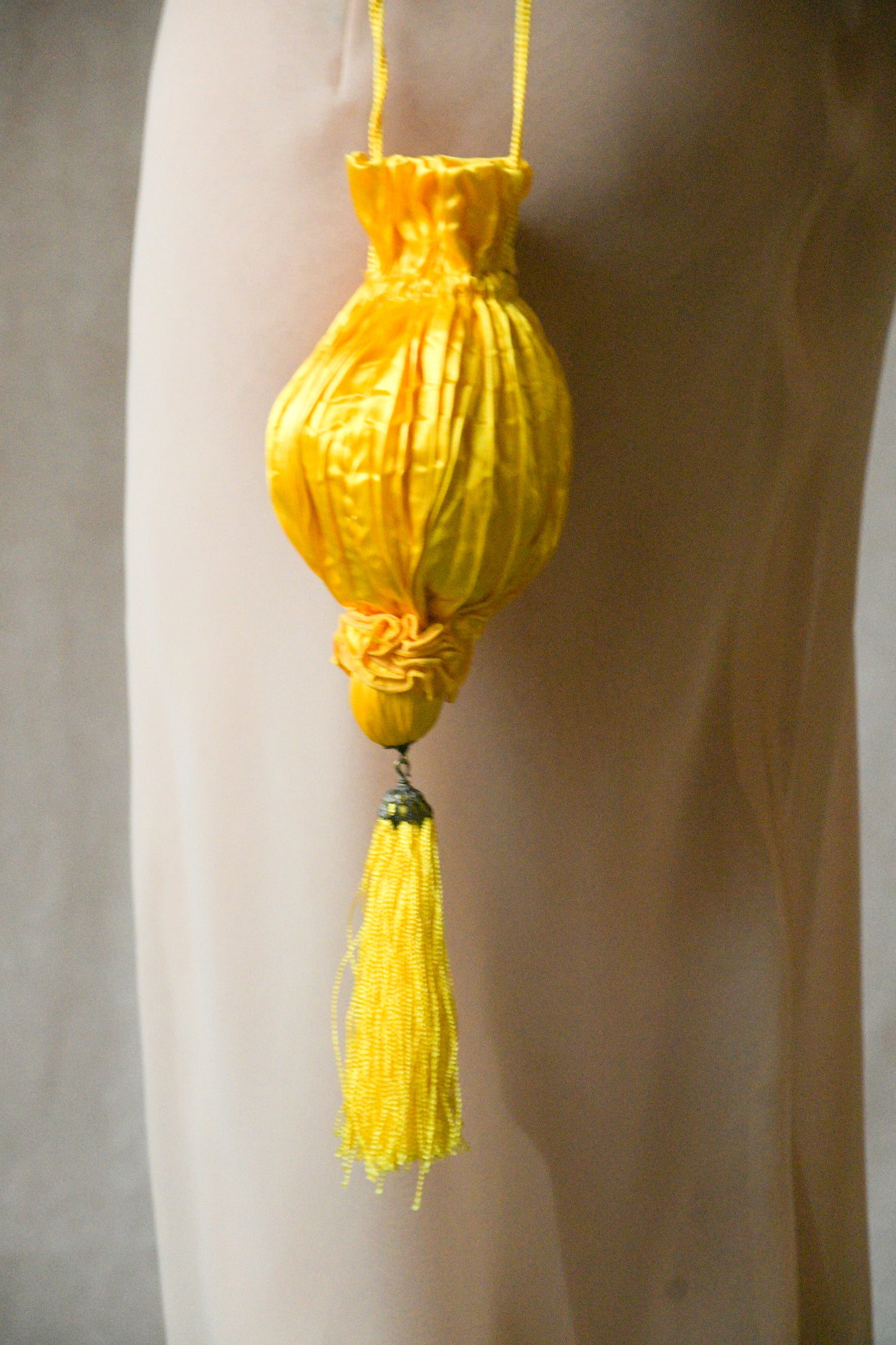 yellow satin crinkled pouch purse with tassel