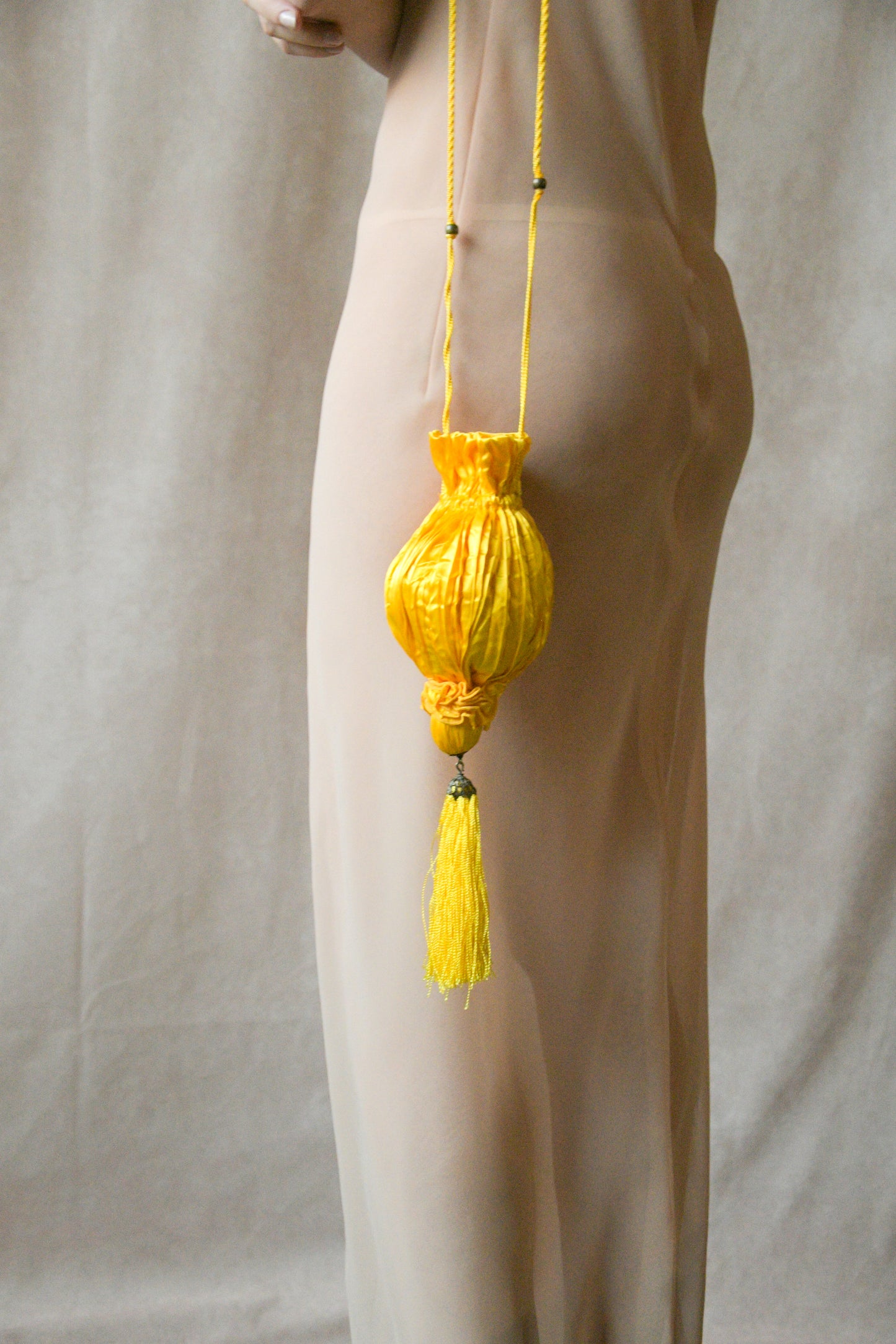 yellow satin crinkled pouch purse with tassel