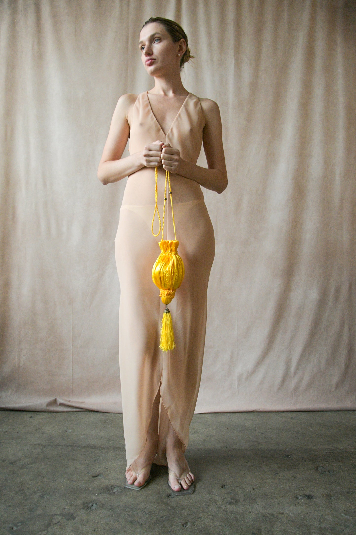 yellow satin crinkled pouch purse with tassel