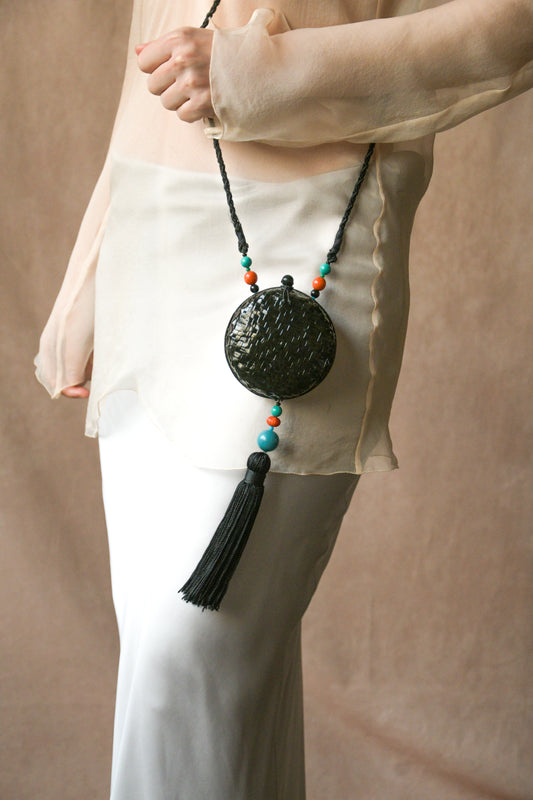 black woven rattan round tassel bag