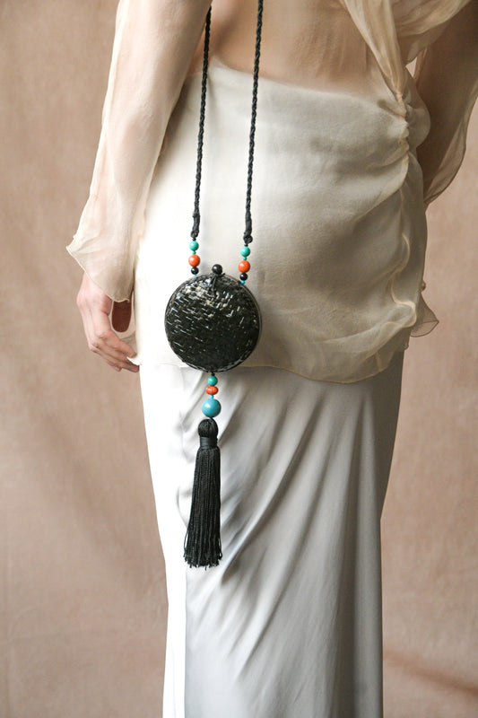 black woven rattan round tassel bag